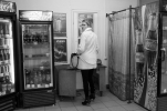 A woman in a general store at the Estonian - Russian border on the Russian side